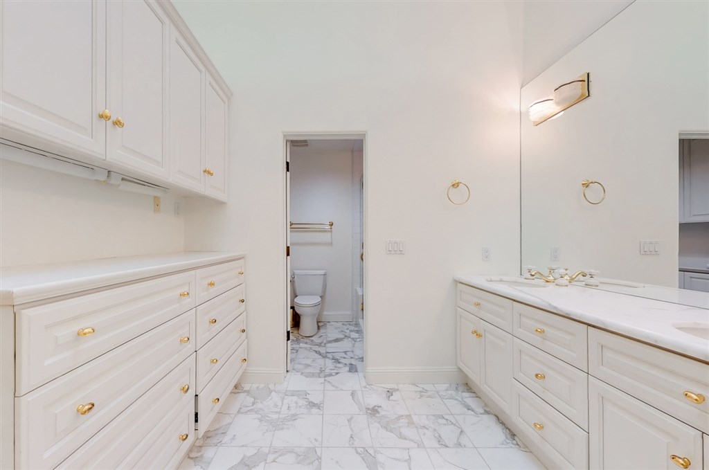 12211 Bajada Road San Diego, CA 92128 - Photo 13 of 23 a spacious bathroom with a sink and a mirror