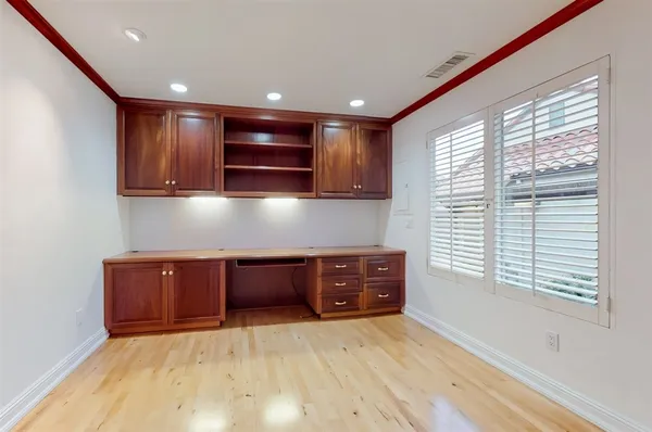a kitchen with granite countertop a stove and a microwave oven