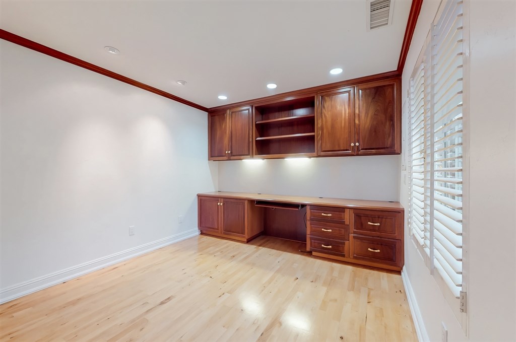 12211 Bajada Road San Diego, CA 92128 - Photo 18 of 23 a kitchen with granite countertop a stove and a microwave oven