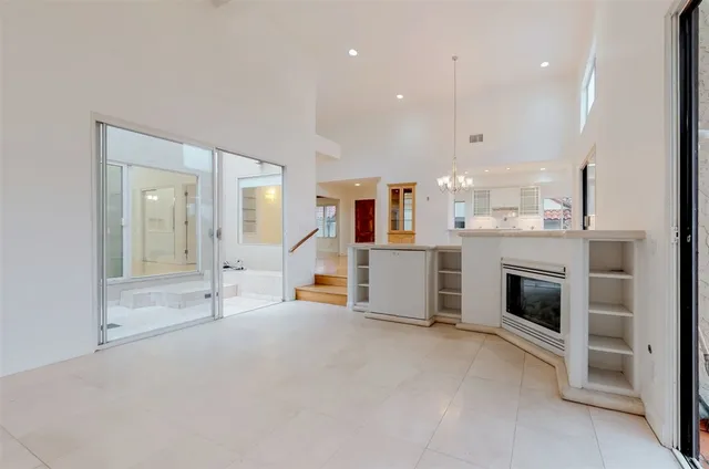 a kitchen with a sink stainless steel appliances and counter space