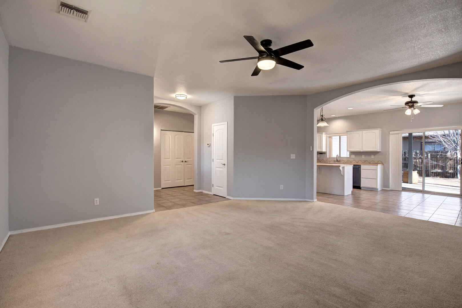 334 East Cedar Mill Road Star Valley, AZ 85541 - Photo 5 of 32 a view of a livingroom with a ceiling fan and window