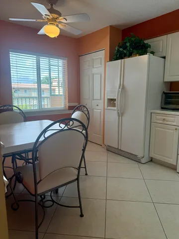 a kitchen with cabinets and appliances