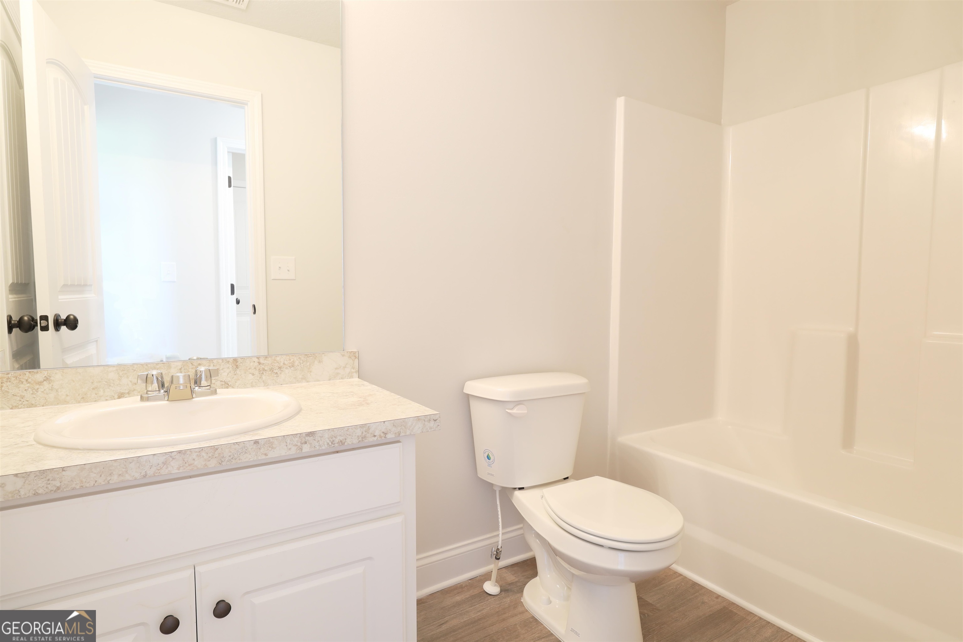 463 Tanners Bridge Road, Unit 2 Bethlehem, GA 30620 - Photo 4 of 6 a bathroom with a sink toilet and mirror