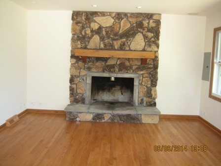 24 Northcrest Road Lake Zurich, IL 60047 - Photo 6 of 14 a living room with a fireplace