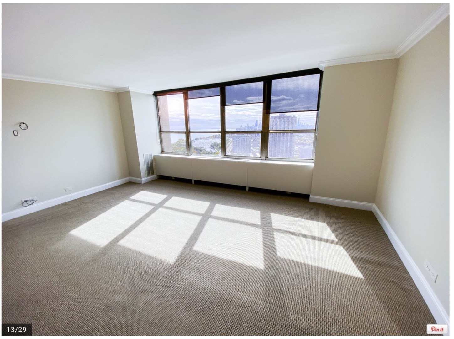 655 West Irving Park Road, Unit 4009 Chicago, IL 60613 - Photo 13 of 27 a view of an empty room with a window