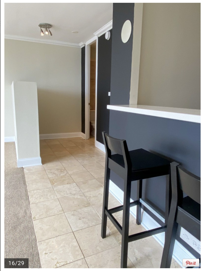 655 West Irving Park Road, Unit 4009 Chicago, IL 60613 - Photo 16 of 27 a view of a livingroom with furniture and window