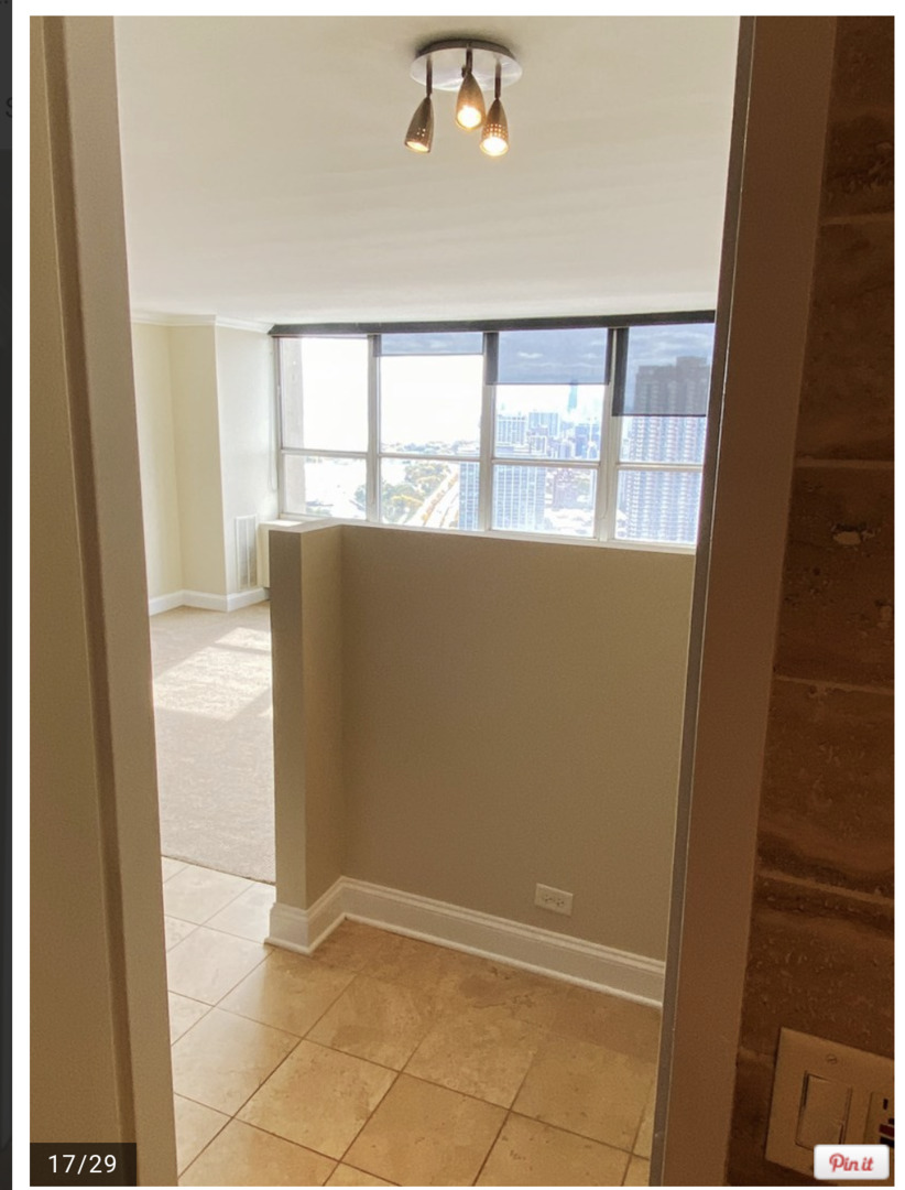655 West Irving Park Road, Unit 4009 Chicago, IL 60613 - Photo 17 of 27 a view of an empty room with a window