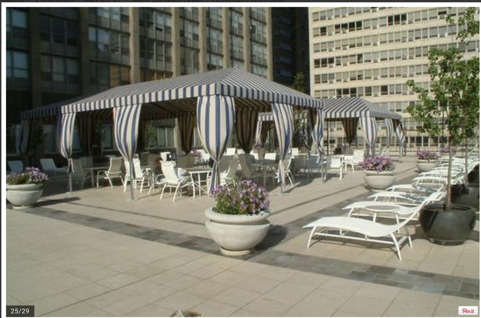 655 West Irving Park Road, Unit 4009 Chicago, IL 60613 - Photo 21 of 27 a view of a patio with dining table and chairs