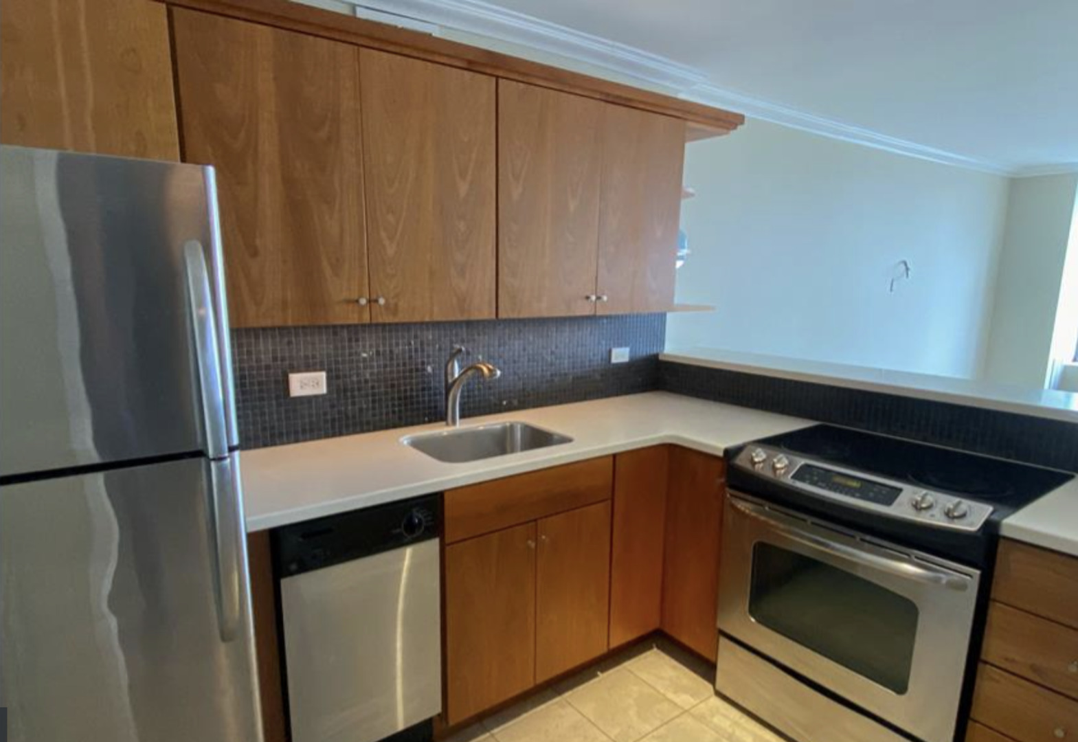 655 West Irving Park Road, Unit 4009 Chicago, IL 60613 - Photo 8 of 27 a view of a kitchen with washer and dryer