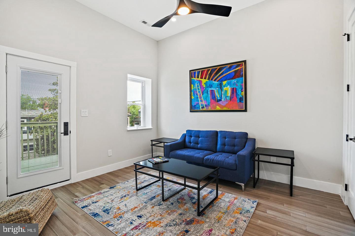 719 Quebec Place Northwest Washington, DC 20010 - Photo 22 of 32 Bright and airy living space with vibrant art.