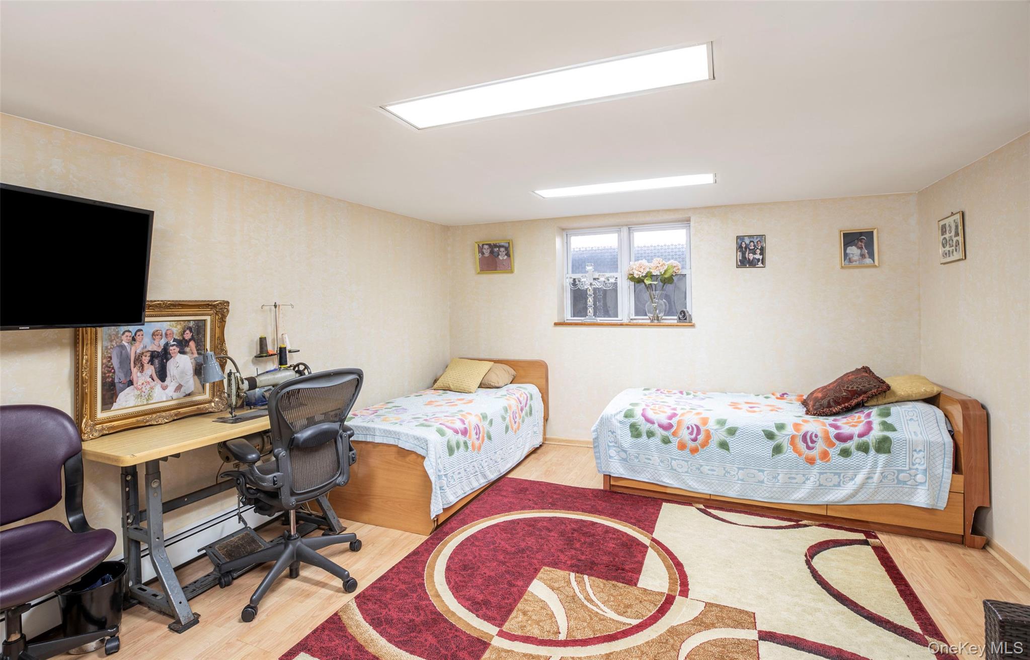 99-64 65th Avenue Queens, NY 11374 - Photo 15 of 22 a living room with furniture and a flat screen tv