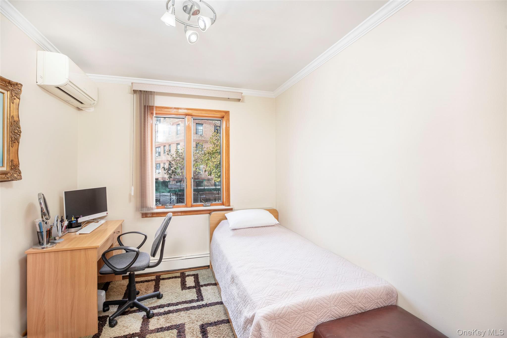 99-64 65th Avenue Queens, NY 11374 - Photo 9 of 22 a bedroom with a bed and a window