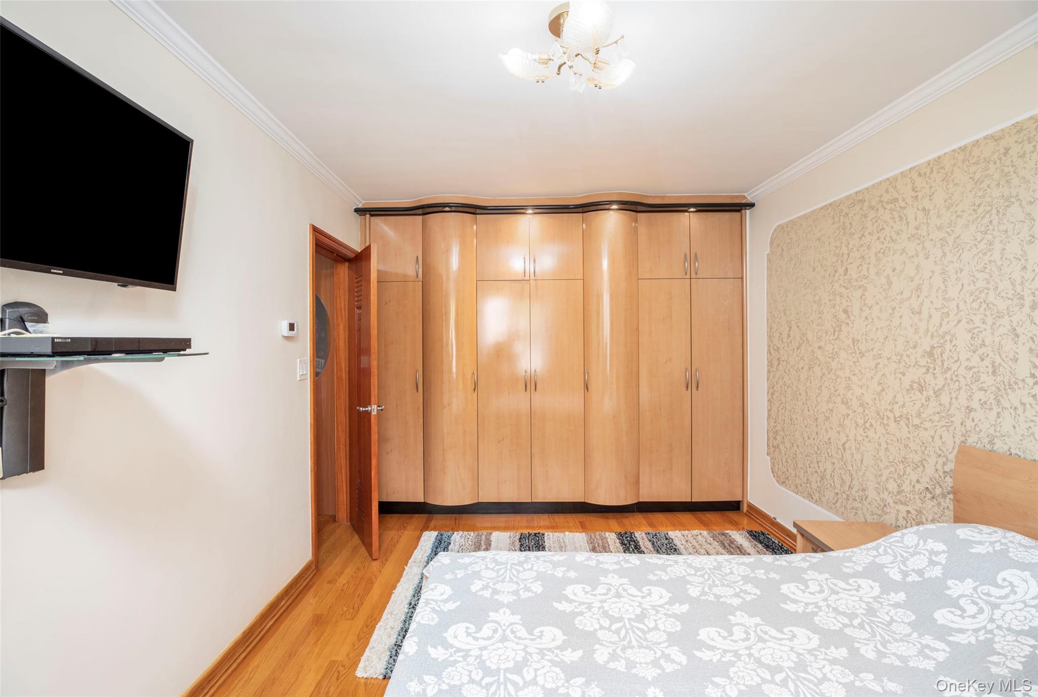 99-64 65th Avenue Queens, NY 11374 - Photo 10 of 22 a view of a room with a flat screen tv