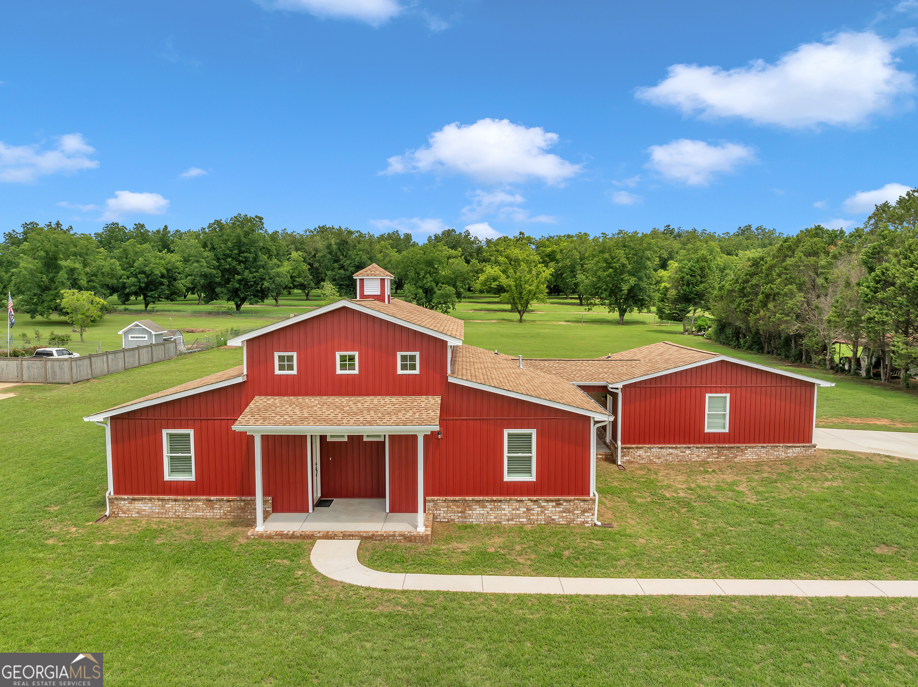 a view of a big house with a big yard