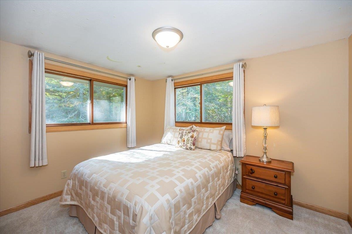 6891 South Oakland Road Superior, WI 54880 - Photo 13 of 29 Bedroom with light colored carpet