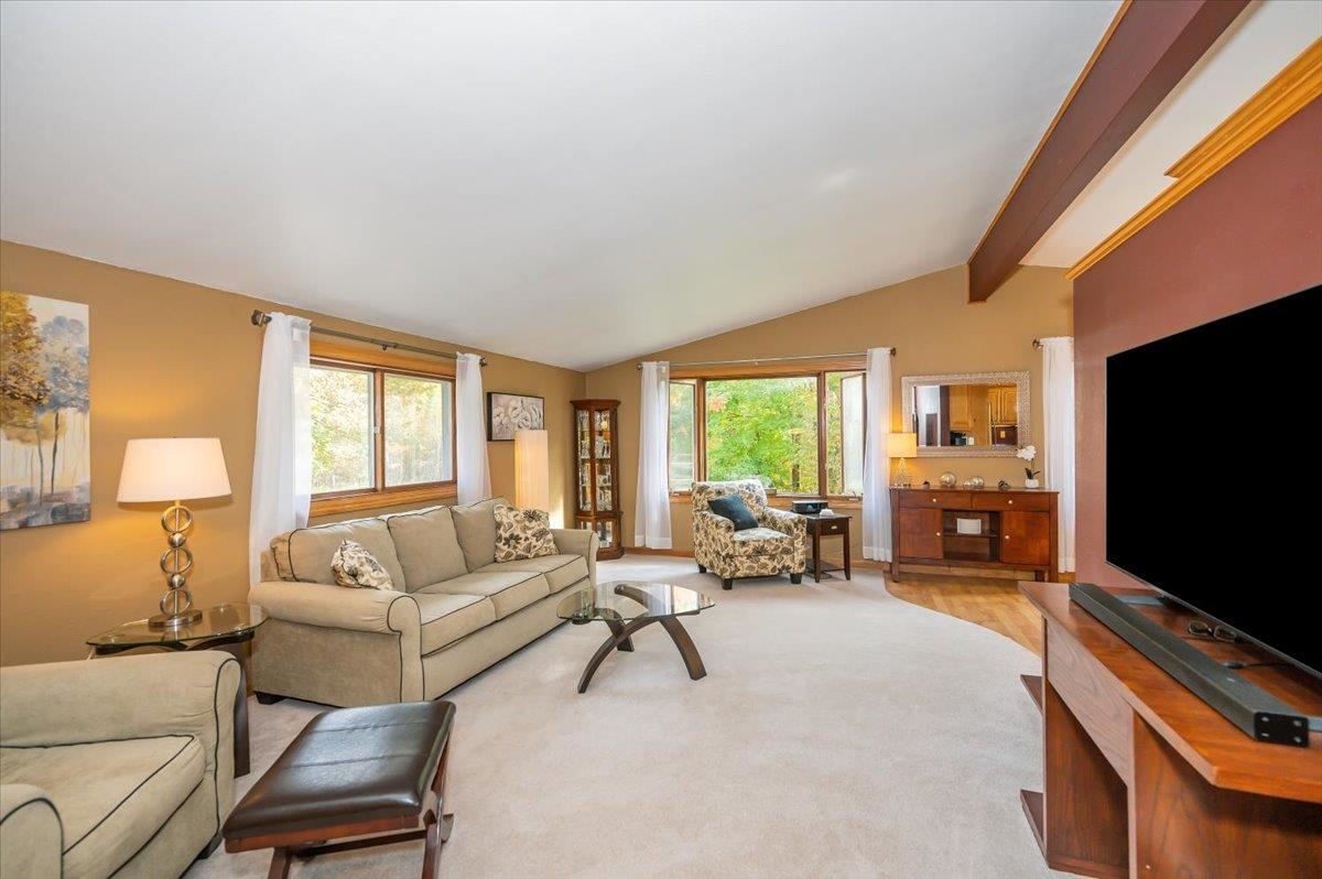 6891 South Oakland Road Superior, WI 54880 - Photo 2 of 29 Carpeted living area featuring healthy amount of natural light