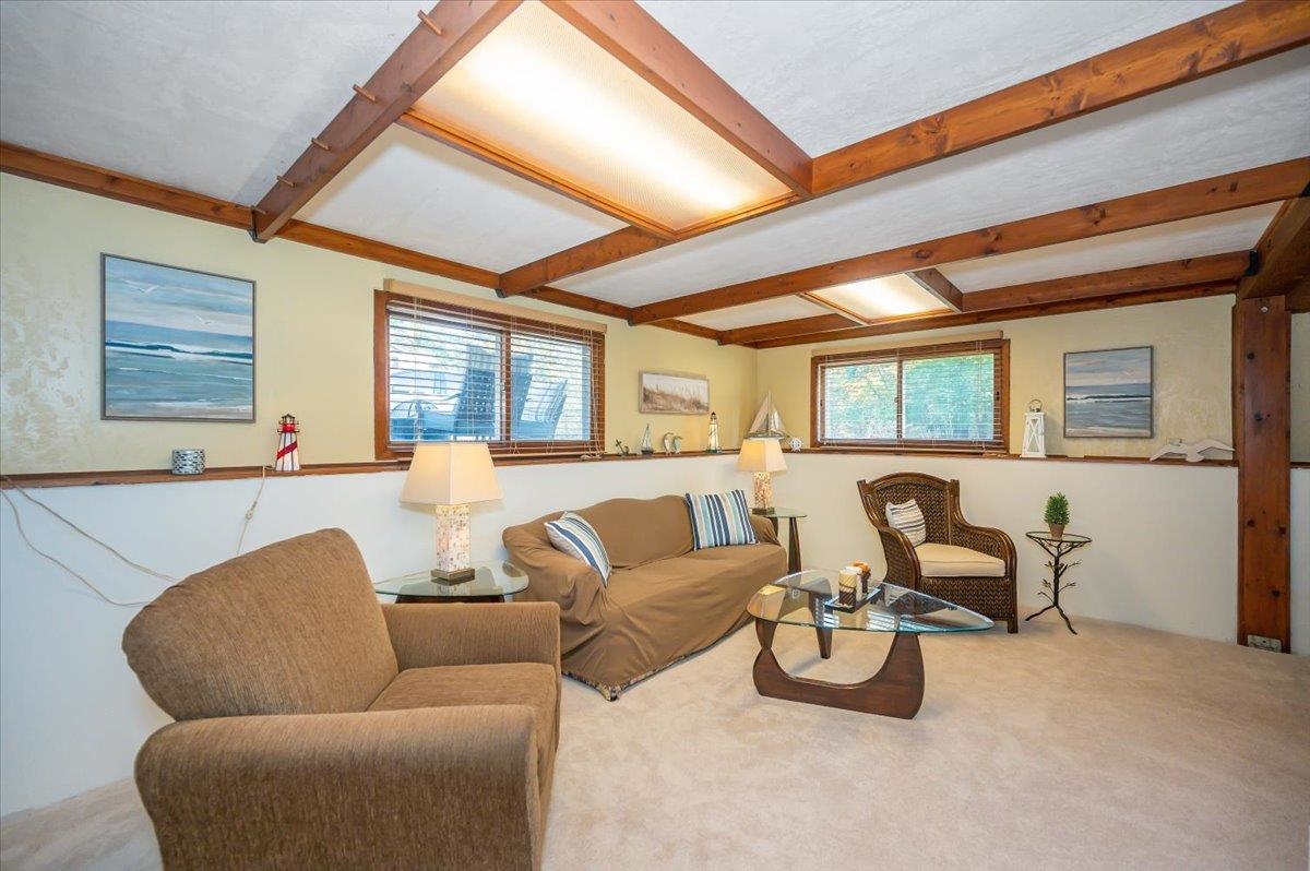 6891 South Oakland Road Superior, WI 54880 - Photo 21 of 29 Living room with beamed ceiling and carpet