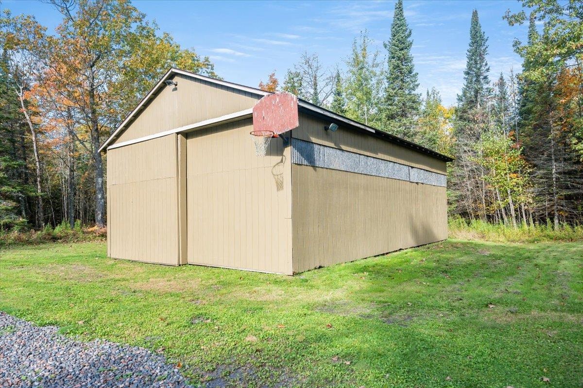 6891 South Oakland Road Superior, WI 54880 - Photo 29 of 29 View of side of home with a lawn and an outdoor structure