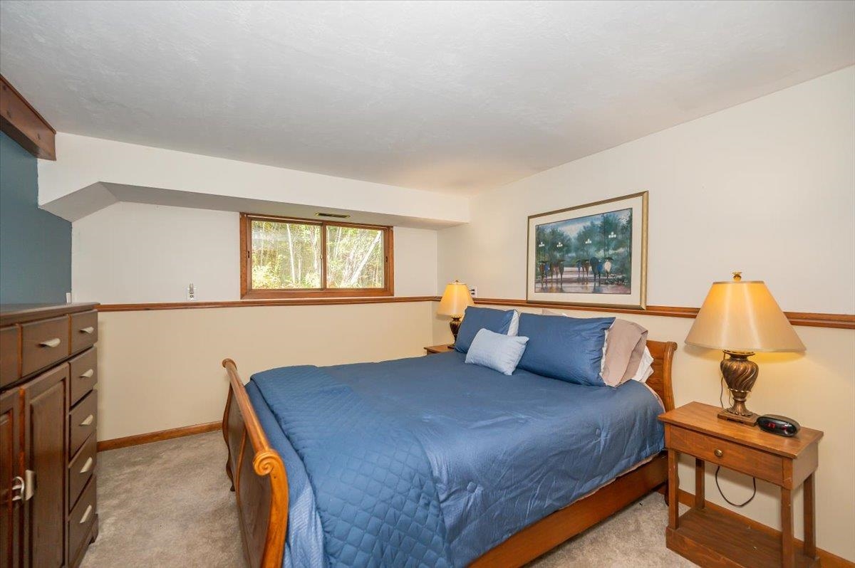 6891 South Oakland Road Superior, WI 54880 - Photo 10 of 29 Bedroom featuring light carpet