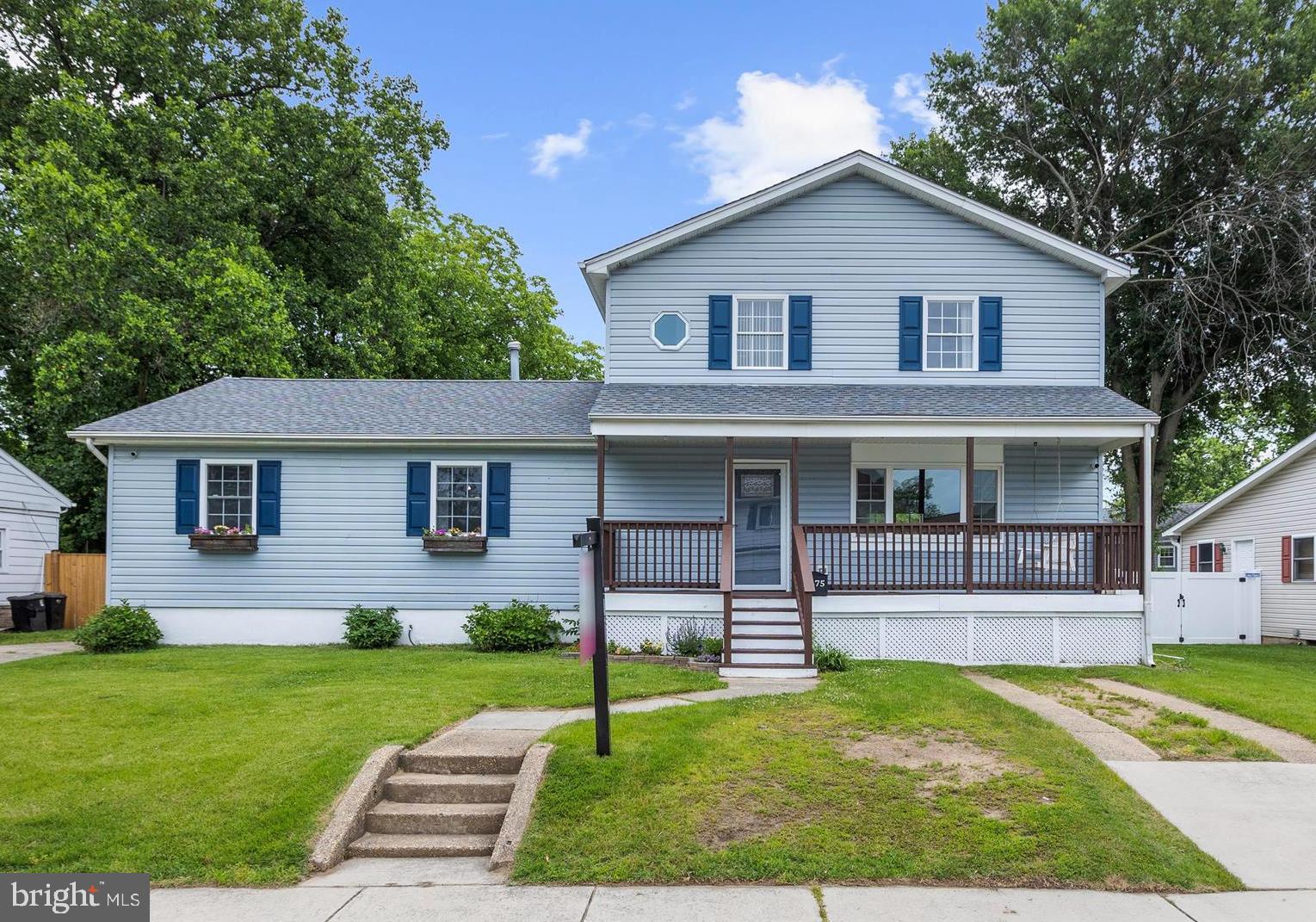 8475 Sexton Road Pasadena, MD 21122 - Photo 1 of 58 a front view of a house with a yard