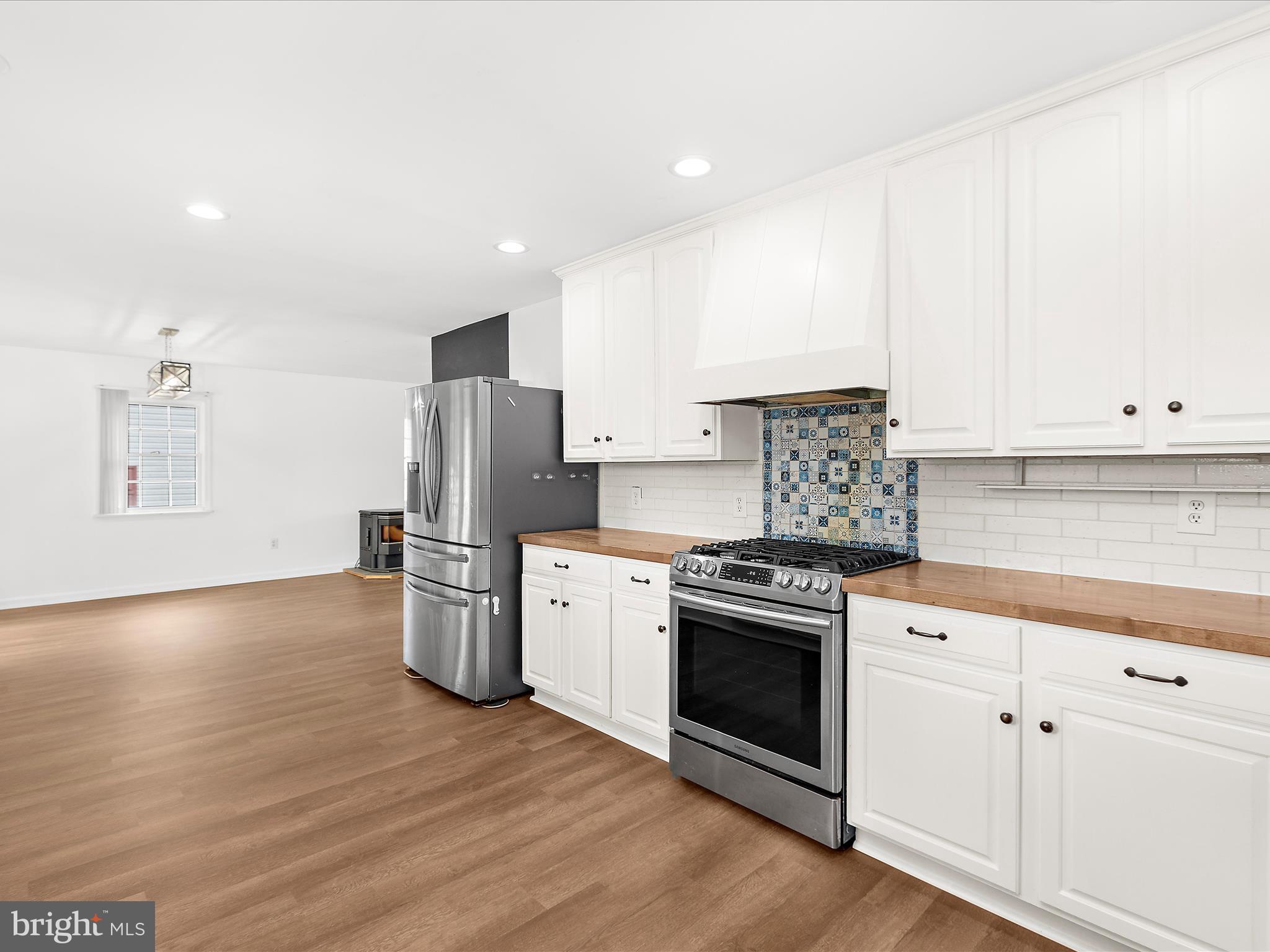 8475 Sexton Road Pasadena, MD 21122 - Photo 11 of 58 a kitchen with a stove a refrigerator and a sink