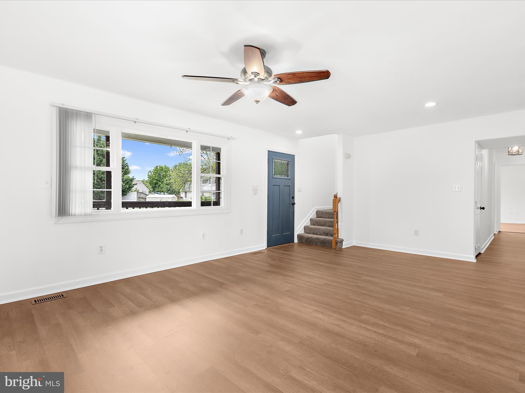 8475 Sexton Road Pasadena, MD 21122 - Photo 15 of 58 a view of empty room with wooden floor and fan