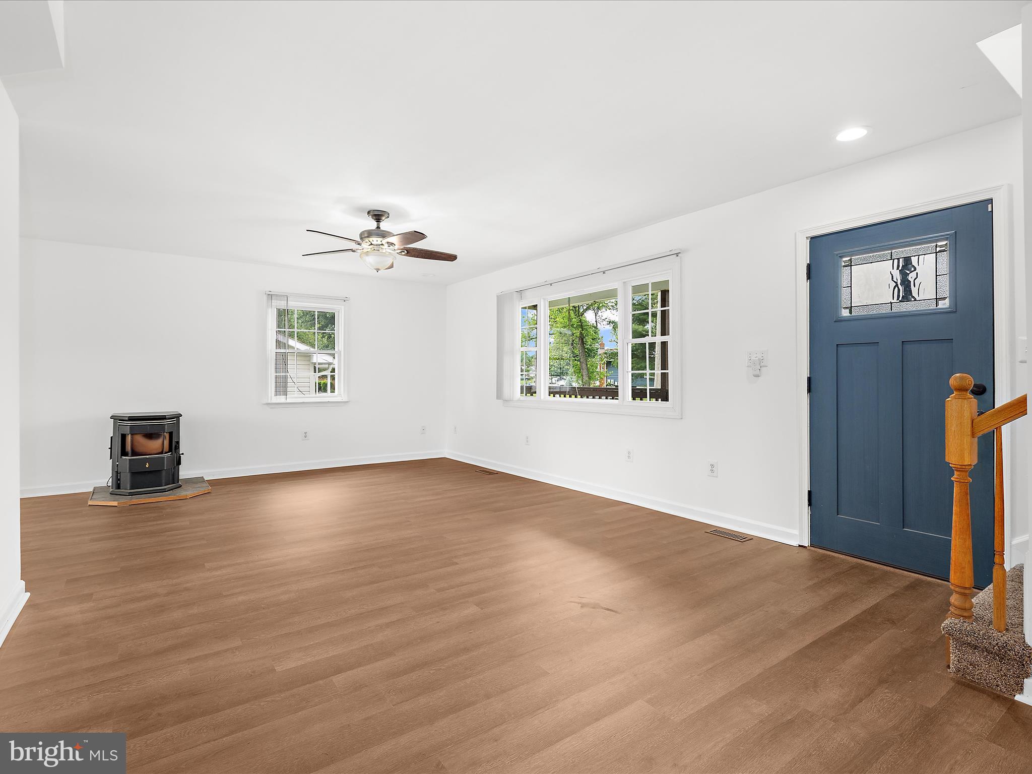 8475 Sexton Road Pasadena, MD 21122 - Photo 16 of 58 wooden floor in an empty room with a window