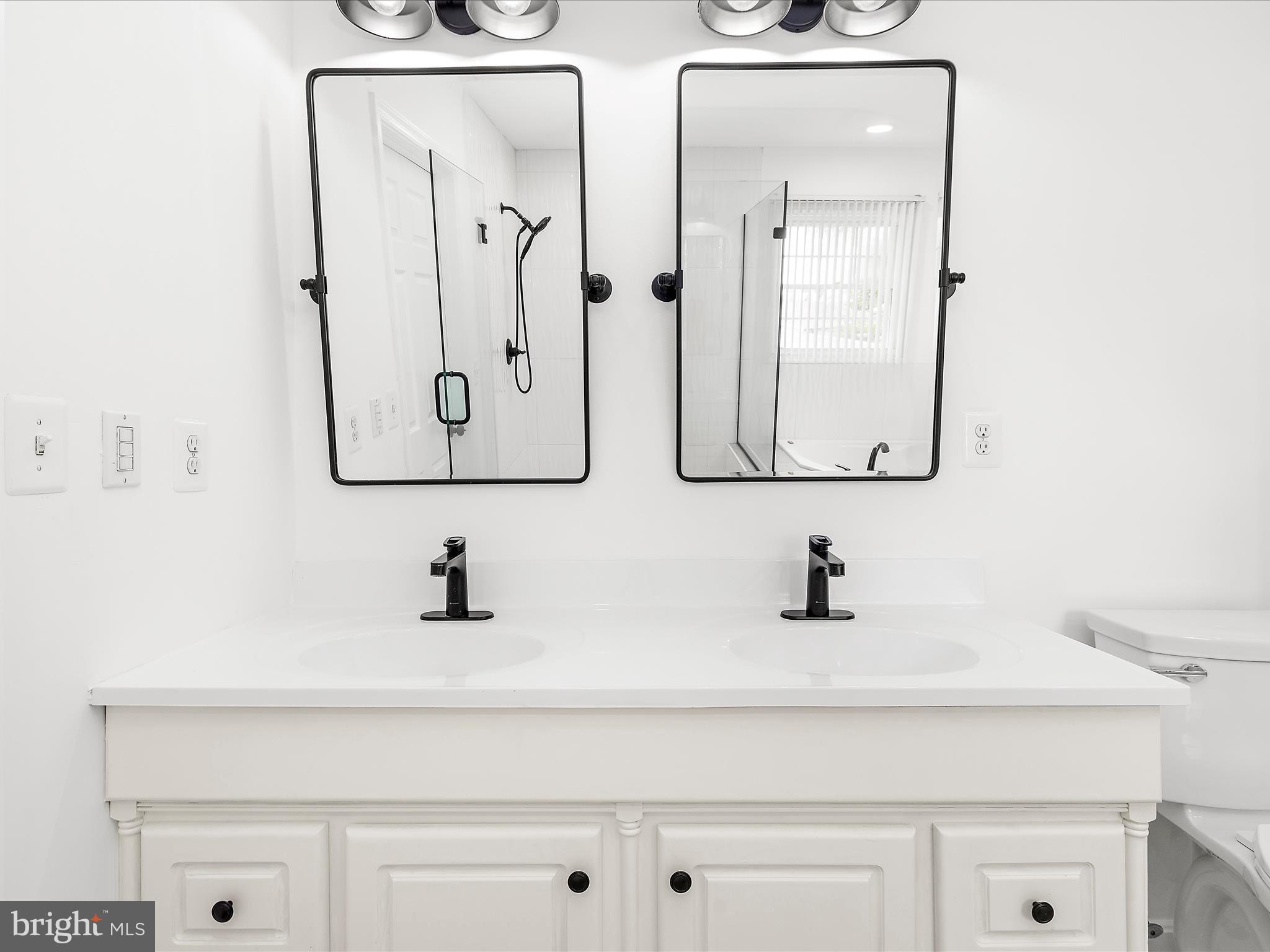 8475 Sexton Road Pasadena, MD 21122 - Photo 22 of 58 a bathroom with a sink and a mirror