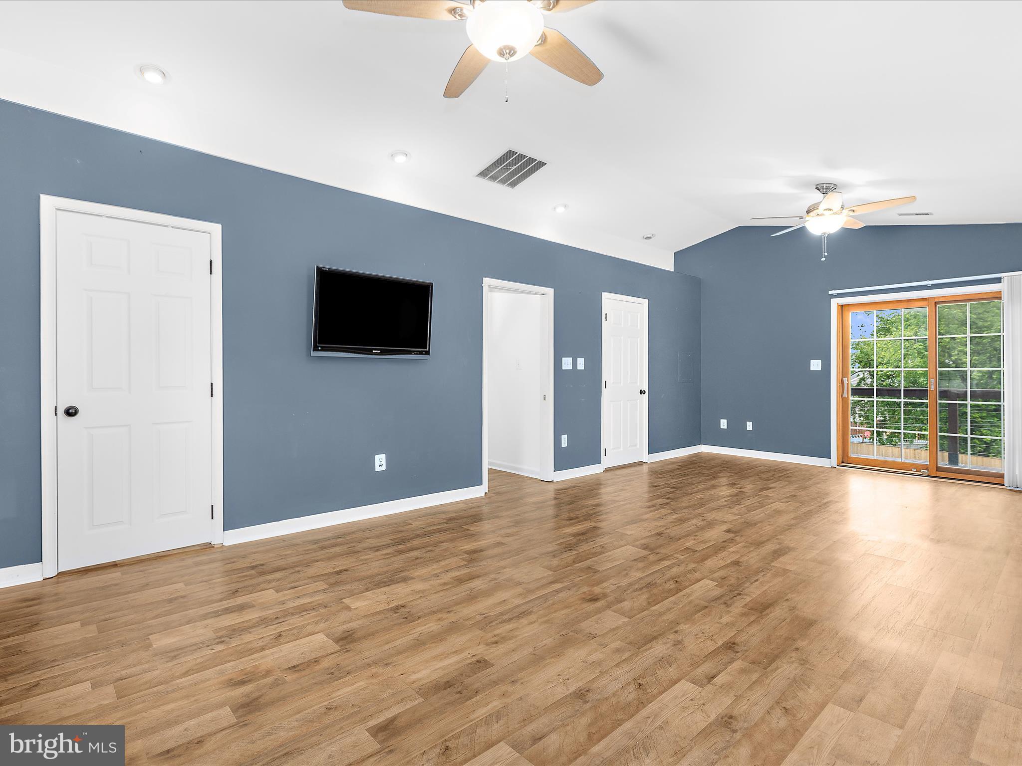 8475 Sexton Road Pasadena, MD 21122 - Photo 25 of 58 a view of a livingroom with a flat screen tv