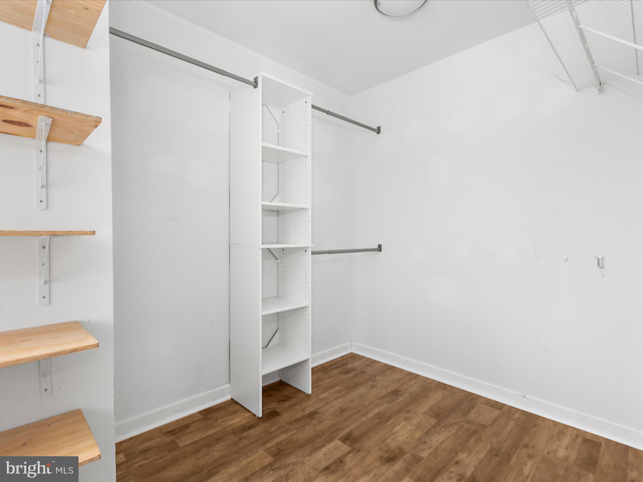 8475 Sexton Road Pasadena, MD 21122 - Photo 30 of 58 a view of an empty room with wooden floor and a window