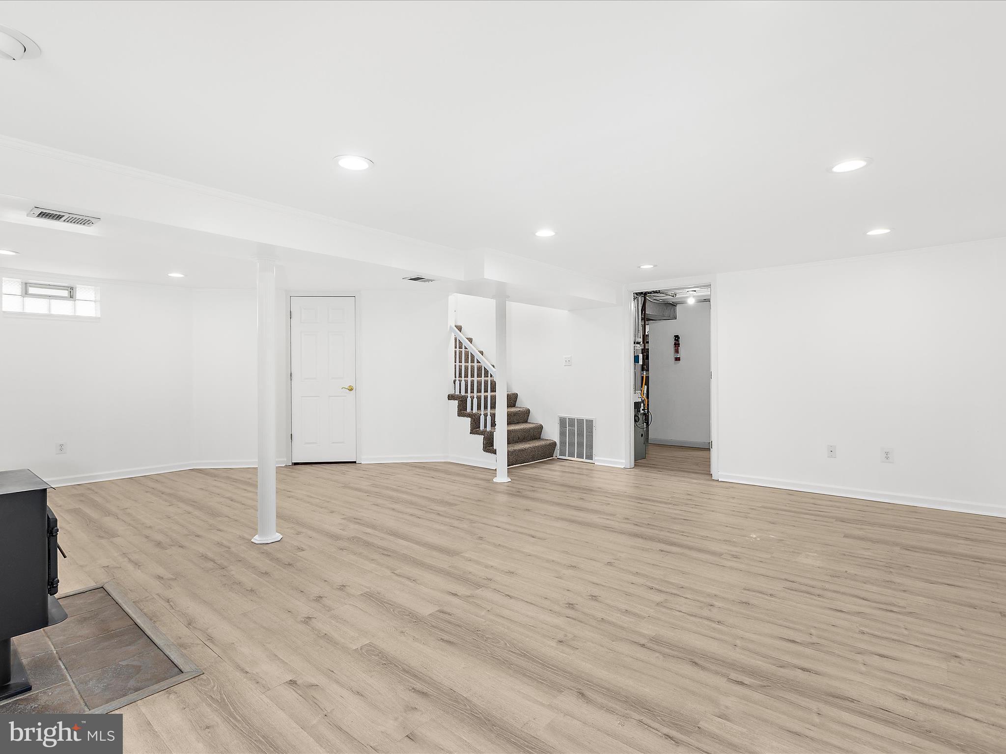 8475 Sexton Road Pasadena, MD 21122 - Photo 41 of 58 a view of an empty room with wooden floor