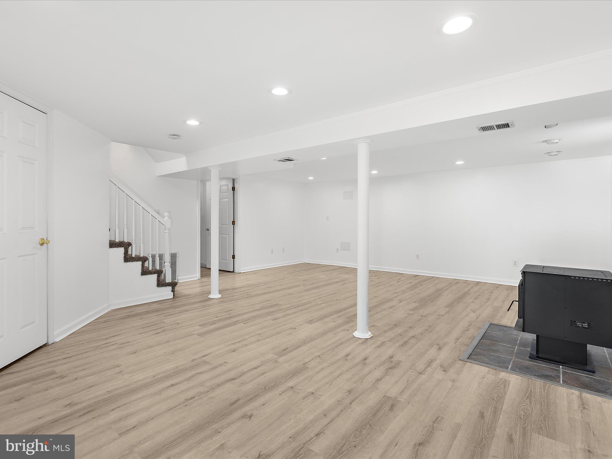 8475 Sexton Road Pasadena, MD 21122 - Photo 42 of 58 a view of an empty room with wooden floor