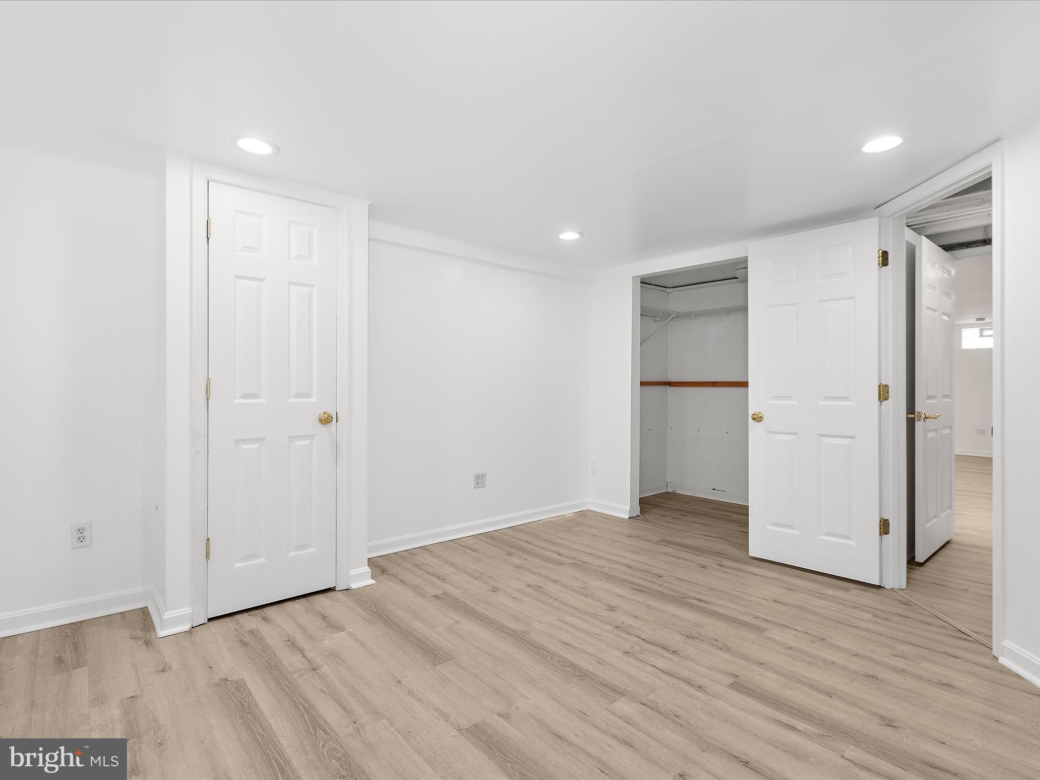8475 Sexton Road Pasadena, MD 21122 - Photo 46 of 58 a view of an empty room with wooden floor and closet area