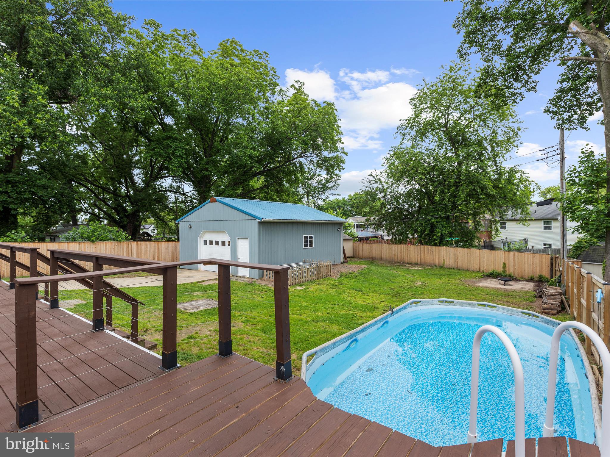 8475 Sexton Road Pasadena, MD 21122 - Photo 52 of 58 a view of a house with backyard and sitting area
