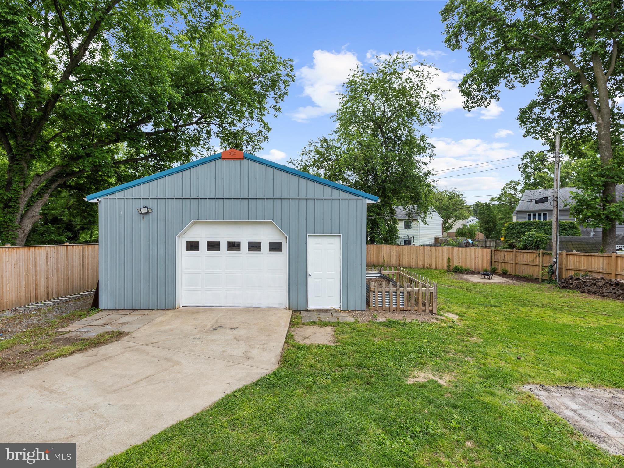 8475 Sexton Road Pasadena, MD 21122 - Photo 53 of 58 a front view of a house with garden