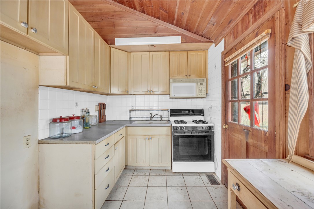 115 Little Stakey Rd Mountain Rest Mountain Rest, SC 29664 - Photo 12 of 38 This cozy kitchen features a practical layout with warm wood accents and abundant natural light.