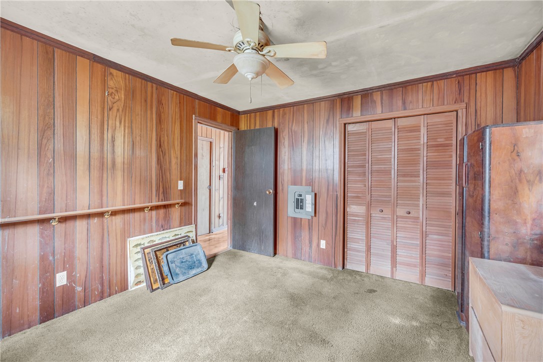 115 Little Stakey Rd Mountain Rest Mountain Rest, SC 29664 - Photo 15 of 38 This cozy room features warm wood paneling, a ceiling fan, and ample storage.