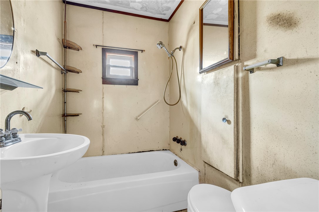 115 Little Stakey Rd Mountain Rest Mountain Rest, SC 29664 - Photo 18 of 38 This functional bathroom features a classic pedestal sink and a bathtub for comfortable daily routines.
