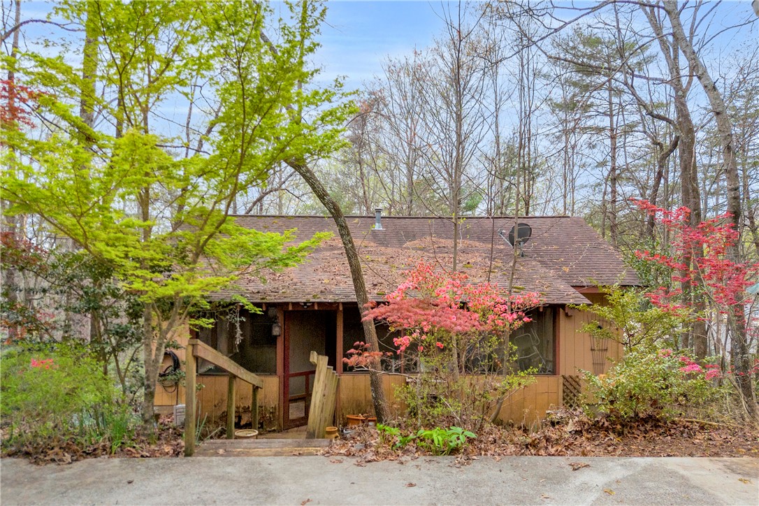 115 Little Stakey Rd Mountain Rest Mountain Rest, SC 29664 - Photo 21 of 38 Nestled among lush trees, this inviting property offers a tranquil retreat.