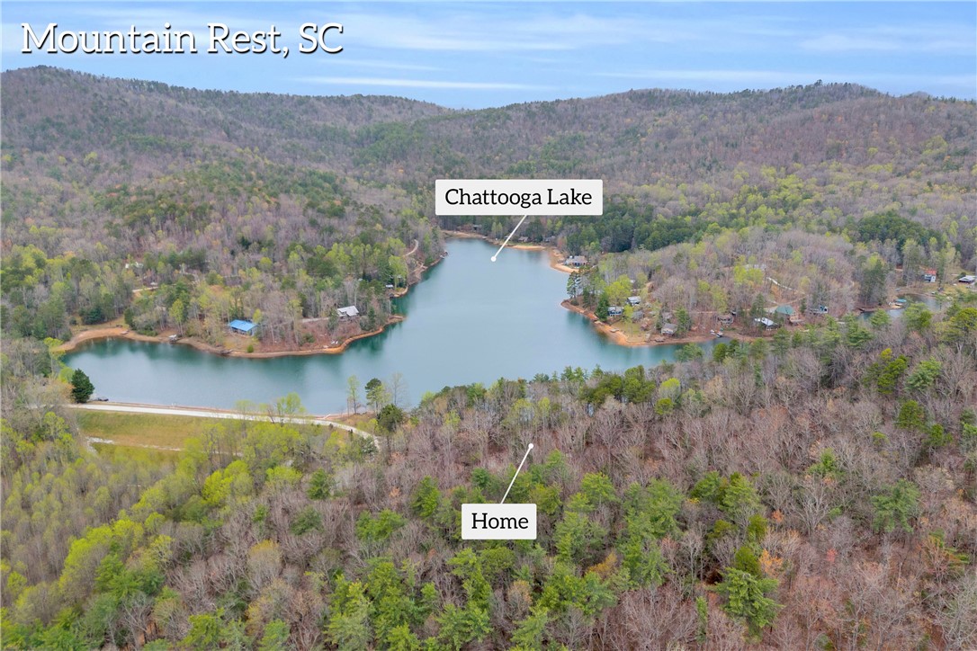 115 Little Stakey Rd Mountain Rest Mountain Rest, SC 29664 - Photo 3 of 38 Perched above Chatanooga Lake, this property offers serene waterfront access amid lush, natural surroundings.