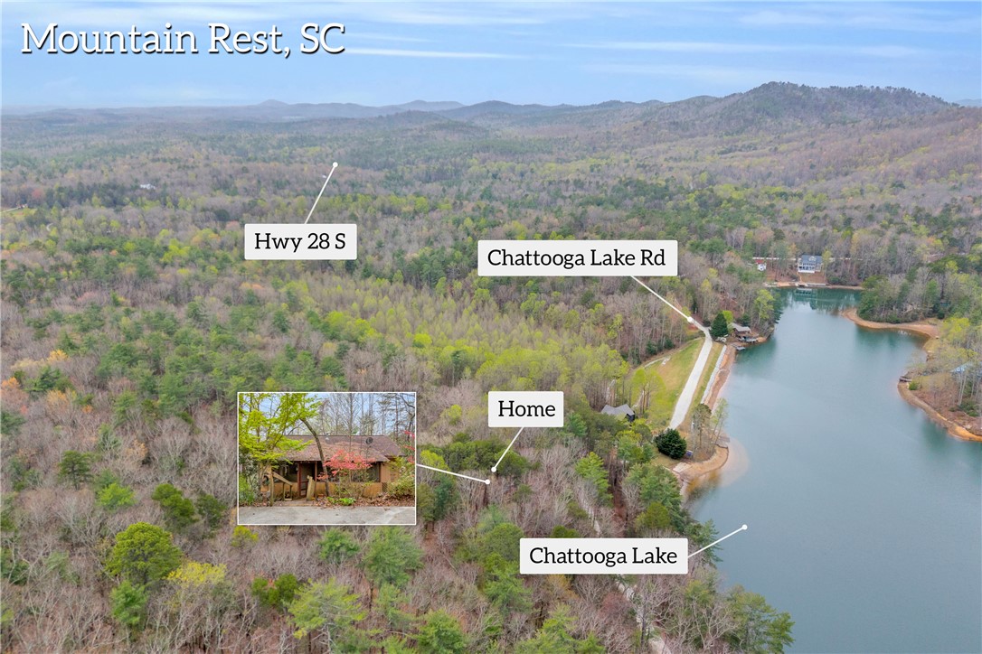 115 Little Stakey Rd Mountain Rest Mountain Rest, SC 29664 - Photo 33 of 38 This captivating aerial view showcases a peaceful lakeside property nestled amidst lush woodlands.