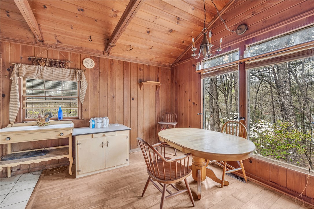 115 Little Stakey Rd Mountain Rest Mountain Rest, SC 29664 - Photo 9 of 38 This inviting dining area features warm wood finishes and expansive windows, bringing the outdoors in.