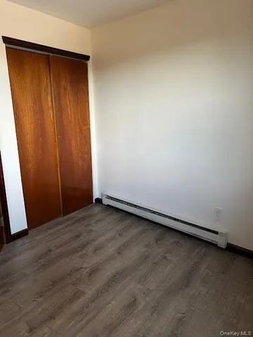 a bathroom with a toilet and bathtub