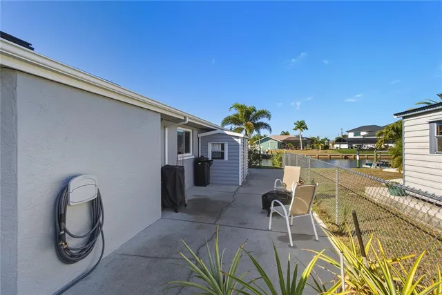 a front view of a house with a garden and yard