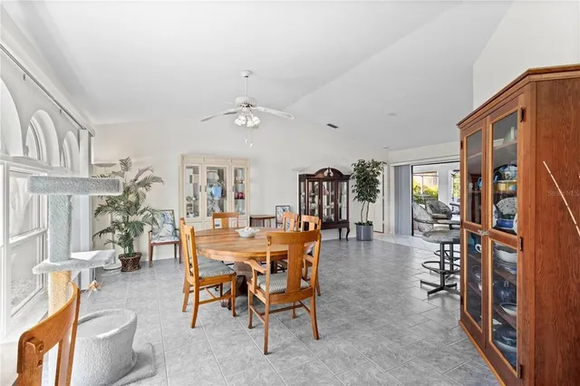 a view of a dining room with furniture window and outdoor view