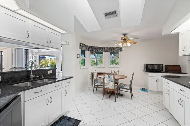 a kitchen with a sink and appliances