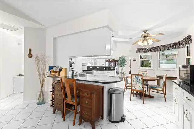a living room with furniture a table and a lamp
