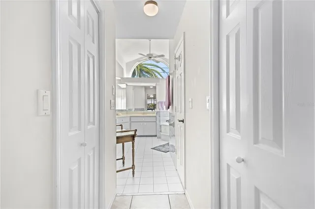 a spacious bathroom with a granite countertop sink mirror and bathtub