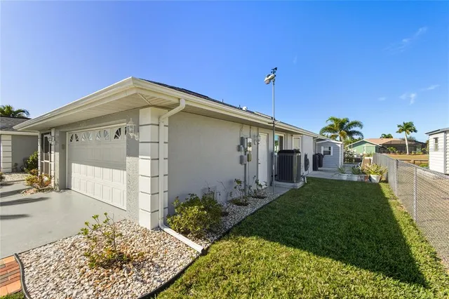 an aerial view of a house with outdoor space