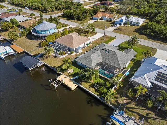 an aerial view of a house with outdoor space